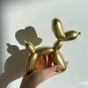 gold balloon dog statue